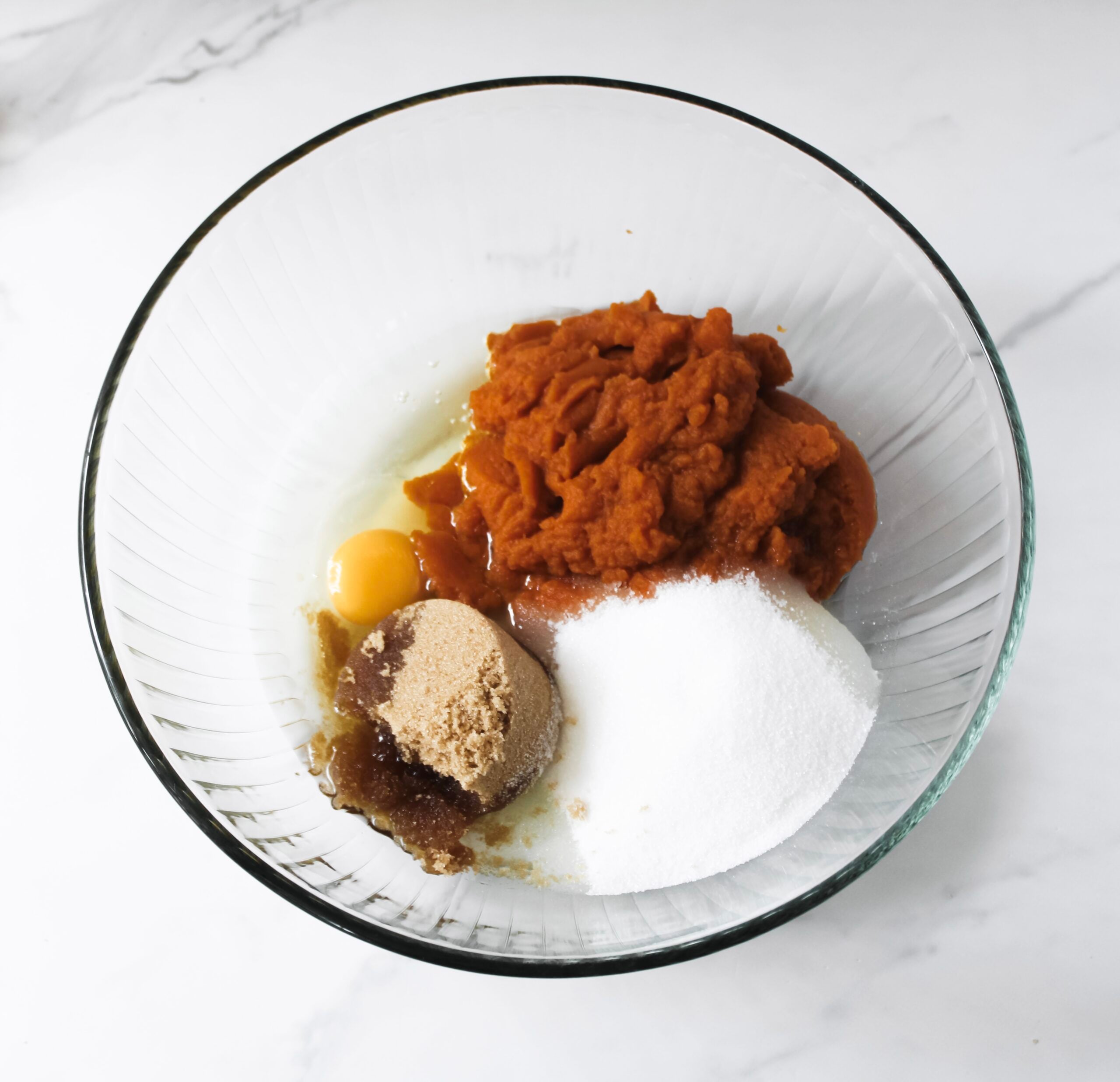 Pumpkin, eggs, vanilla, oil, and sugar.