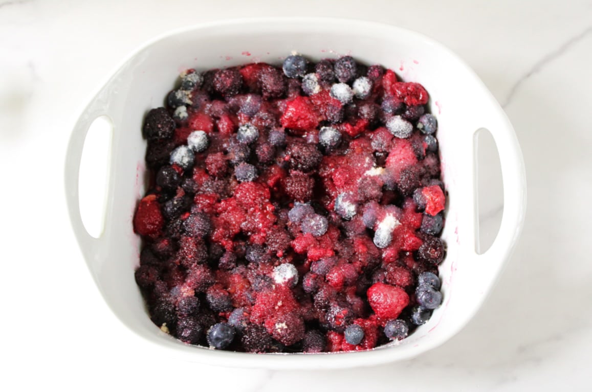 Mixed berries in a ceramic dish.
