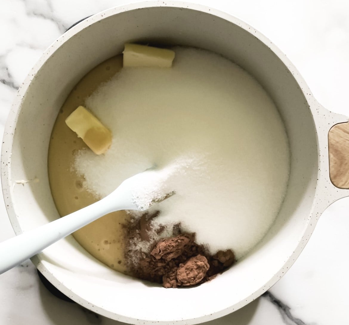 sugar, butter, cocoa powder, milk in a pot