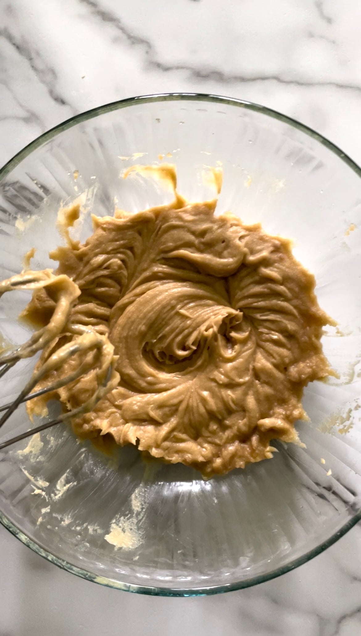 Butter, brown sugar, eggs, and vanilla in a bowl