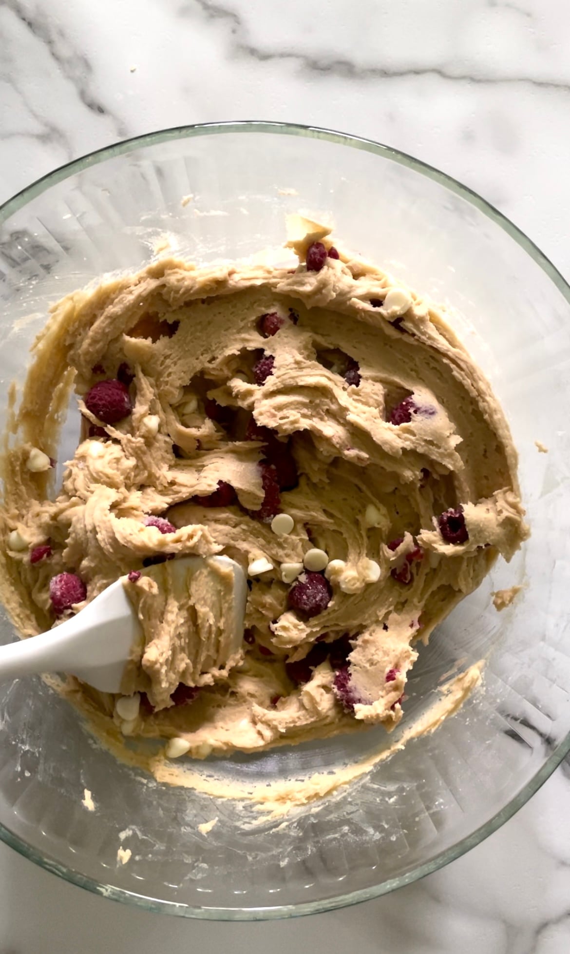 White chocolate raspberry blondies batter in a bowl.