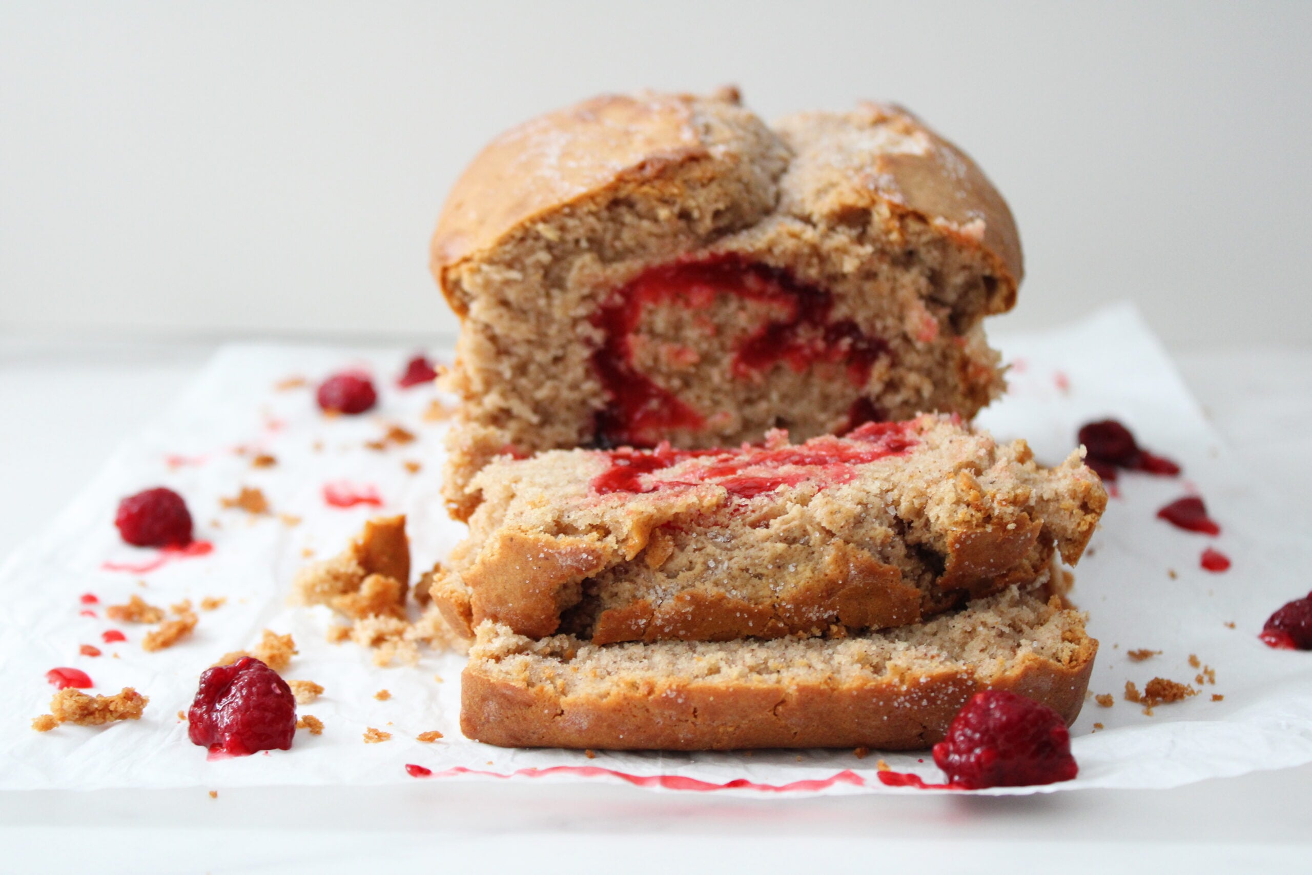 Raspberry swirl bread fully baked and sliced.