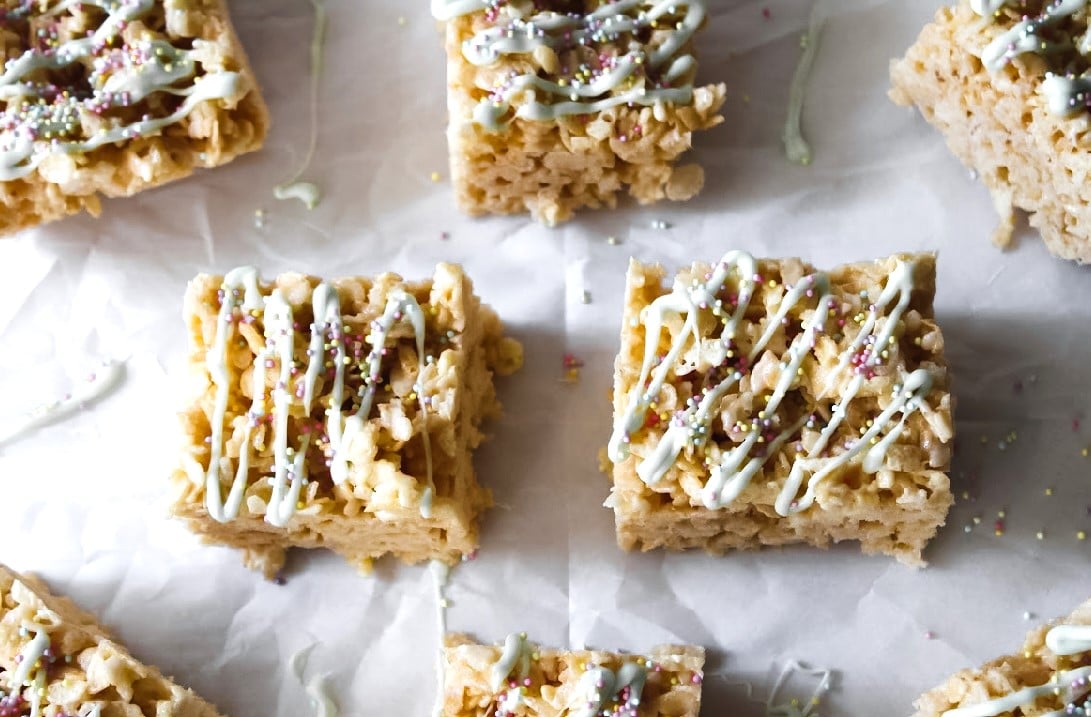 Rice Crispy Treats fully decorated with sprinkles and white chocolate.