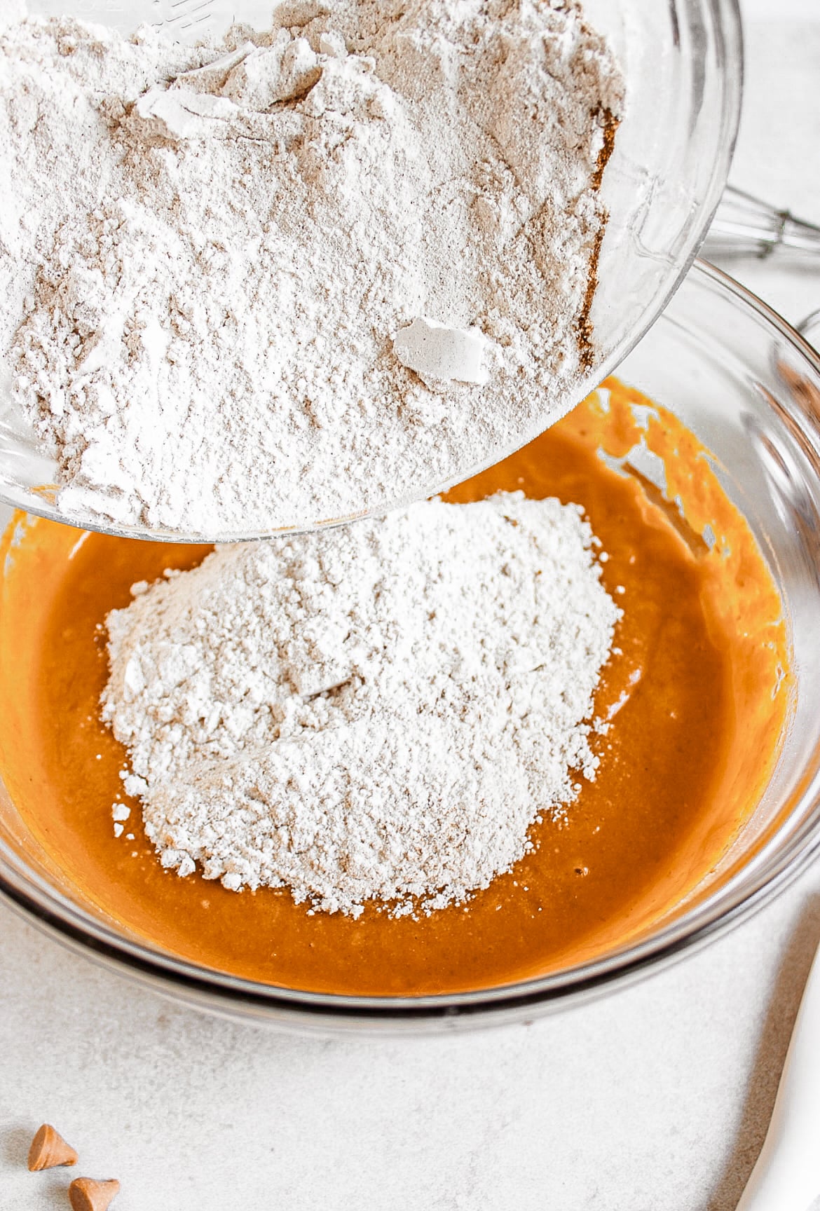 Pumpkin batter and flour in a bowl.