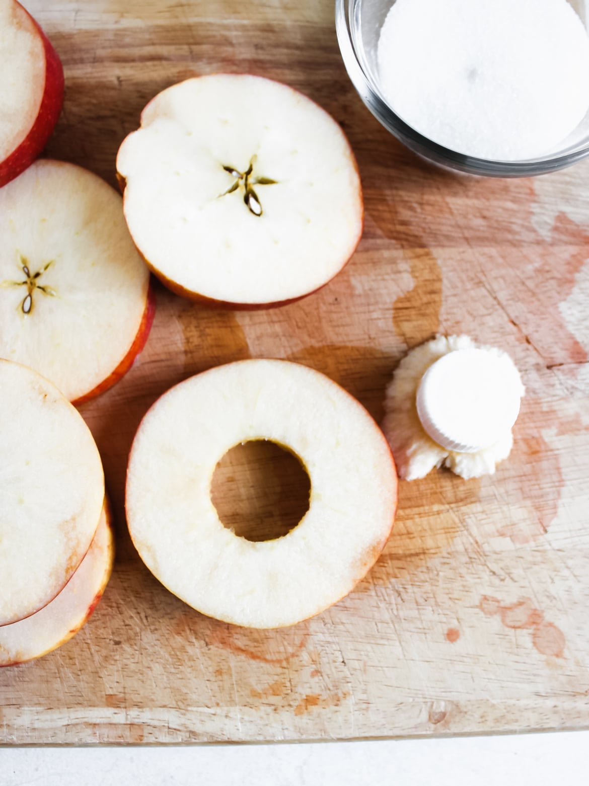 Sliced and cored apples with sugar