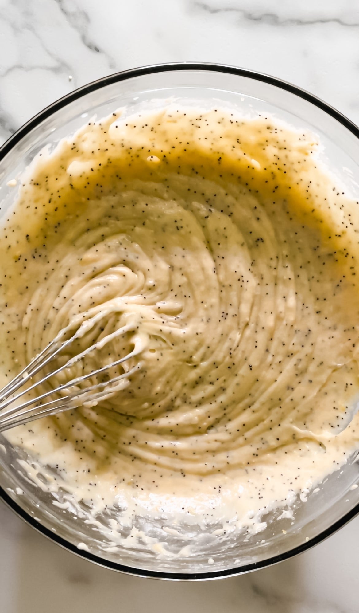 Lemon poppy seed bread batter in a bowl.