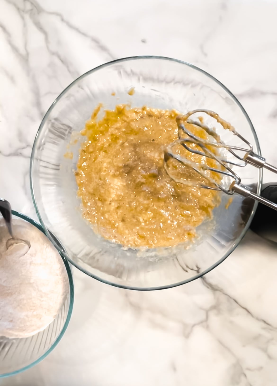 Flour, baking soda, cinnamon, nutmeg, and salt in a bowl. Butter, brown sugar, eggs, and vanilla in a bowl.