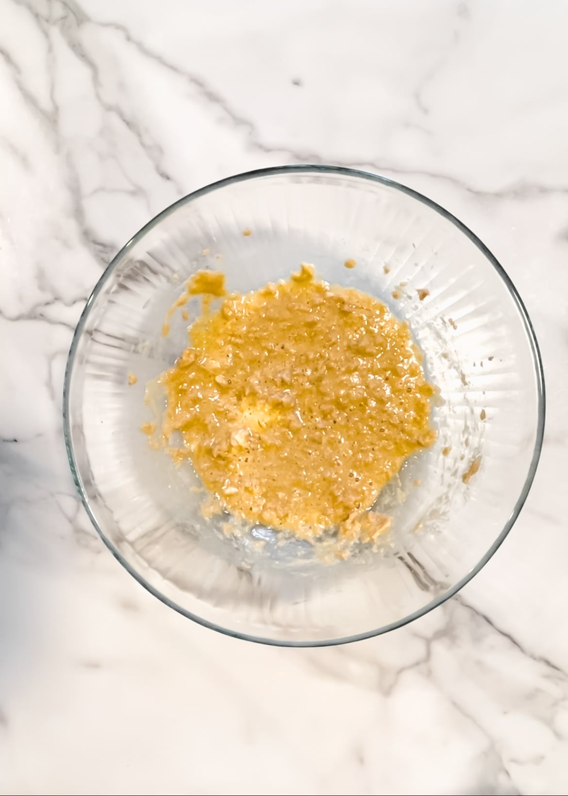 Butter, brown sugar, eggs, and vanilla in a bowl.