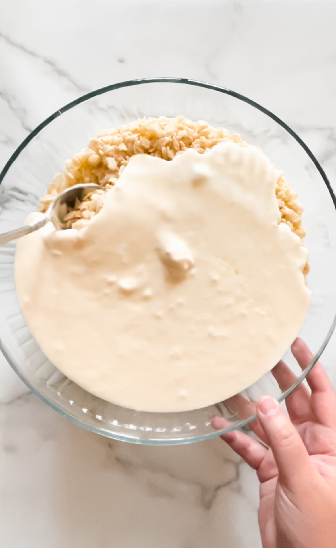 Rice Crispy cereal in a bowl with butter, salt and marshmallows.