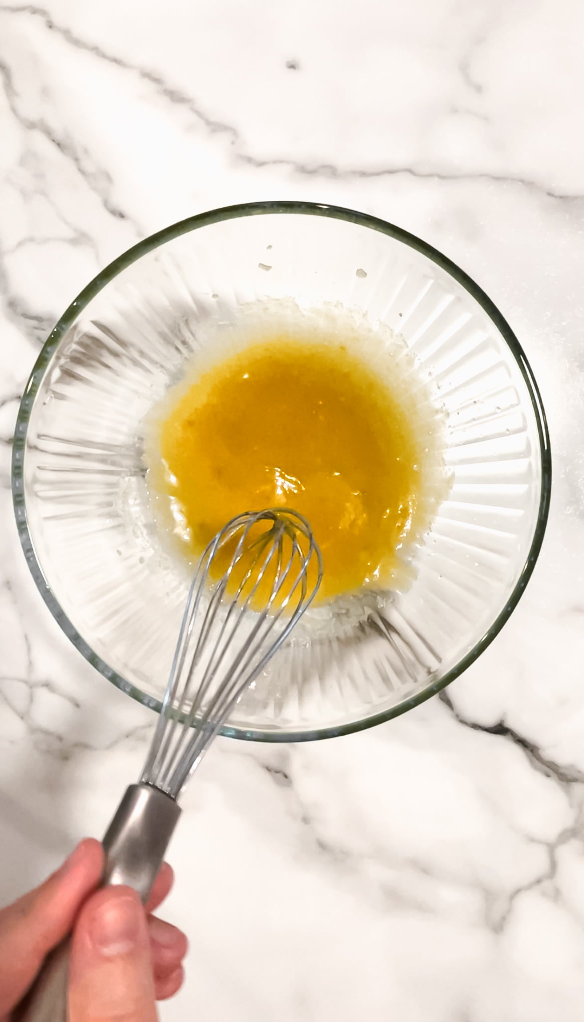 Melted butter, brown sugar, granulated sugar, egg, and vanilla in a mixing bowl with whisk.
