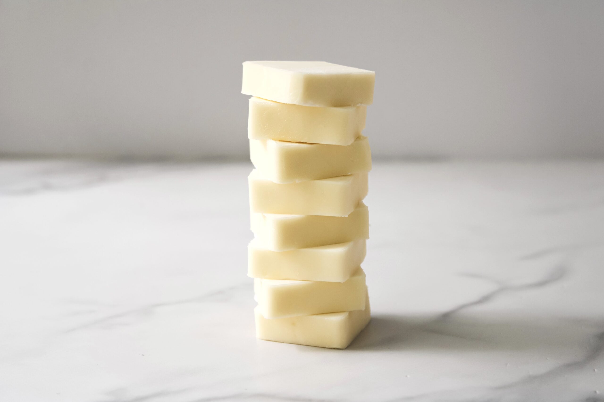 Unsalted butter sliced and stacked.