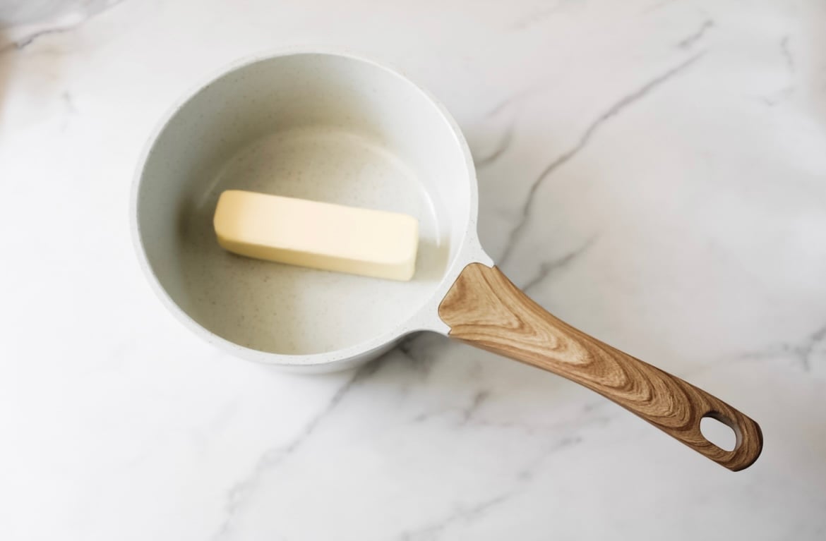 stick of unsalted butter in a saucepan.